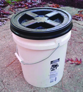 White bucket with black gamma seal lid